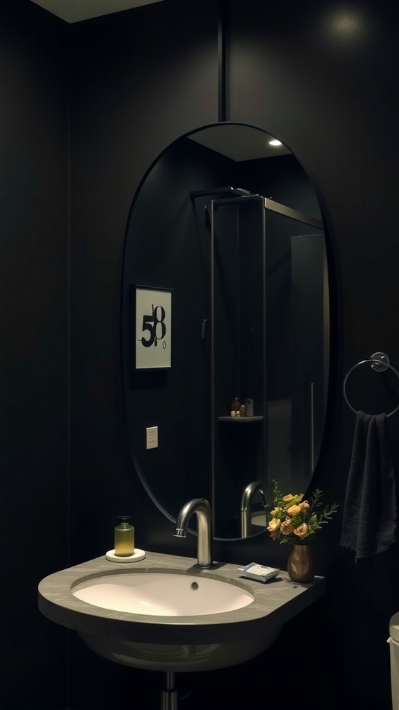 A modern bathroom with a dark color scheme, featuring an oval mirror, a sink, and decorative elements.