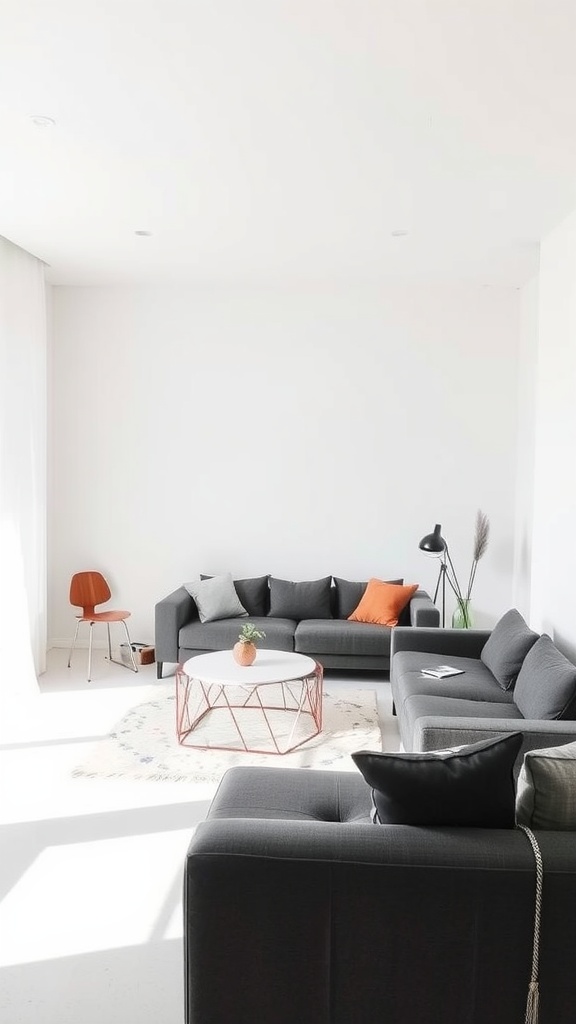 Minimalist living room featuring a dark gray couch, geometric coffee table, and natural decor elements.