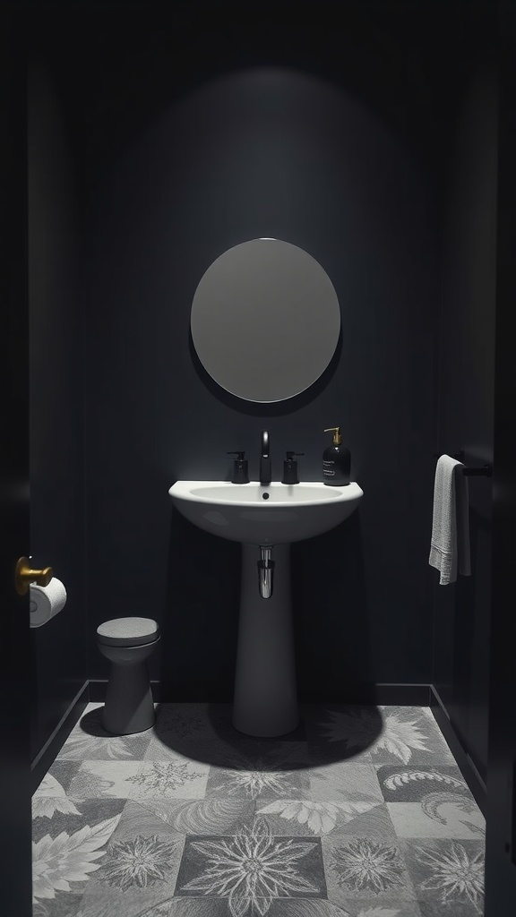 A small dark bathroom featuring a modern pedestal sink, round mirror, and patterned floor tiles.